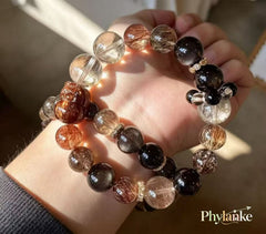 Pixiu Wealth Ward – Pixiu‑Carved Black Gold Super Seven, Silver Obsidian, Tea Rutilated Quartz + Runner Bead