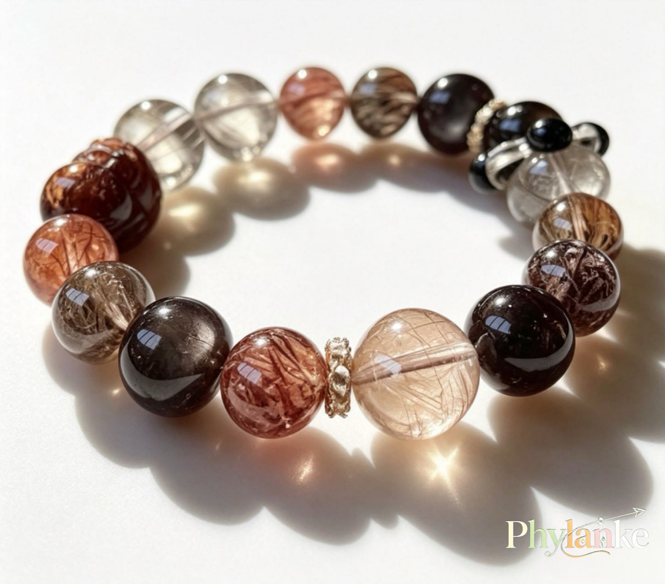 Pixiu Wealth Ward – Pixiu‑Carved Black Gold Super Seven, Silver Obsidian, Tea Rutilated Quartz + Runner Bead