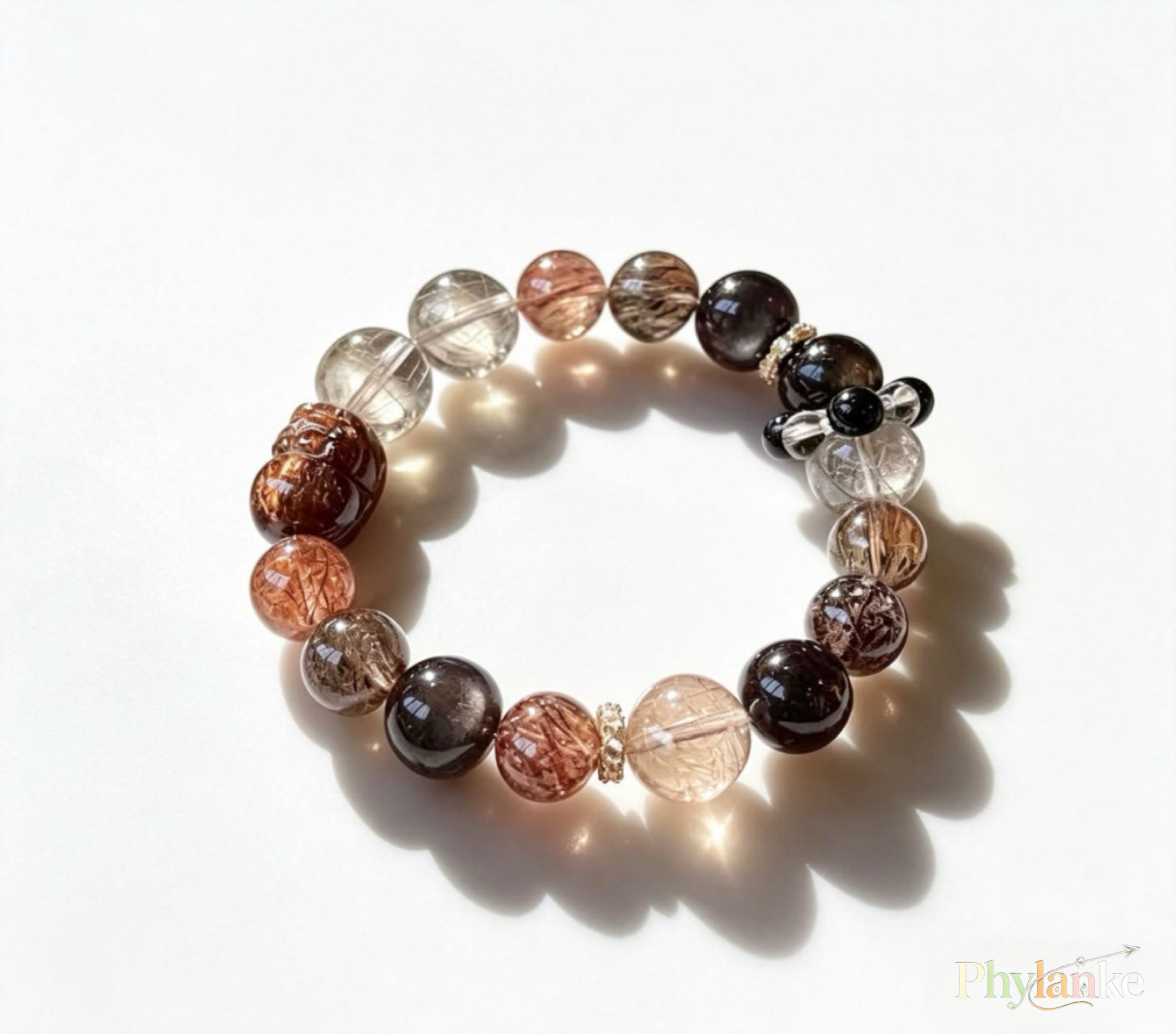 Pixiu Wealth Ward – Pixiu‑Carved Black Gold Super Seven, Silver Obsidian, Tea Rutilated Quartz + Runner Bead